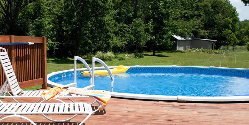 above ground swimming pool with nice deck