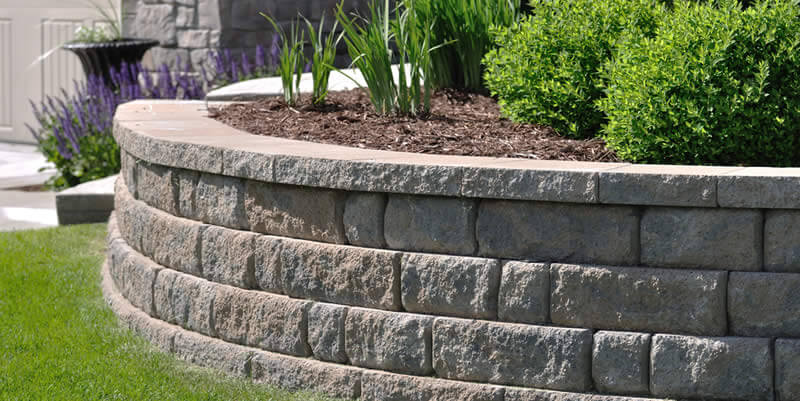 block landscaping retaining wall with planter in it