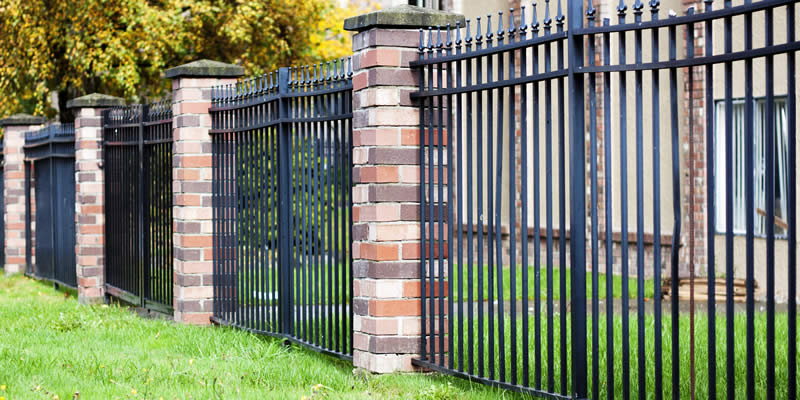 aluminum fence with brick dividers
