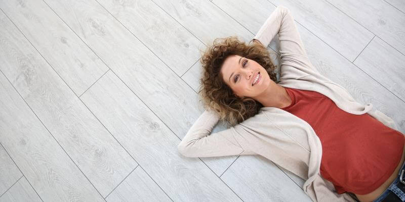 best websites to learn about home flooring with woman on floor