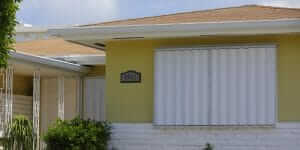 hurricane storm shutters on exterior of house