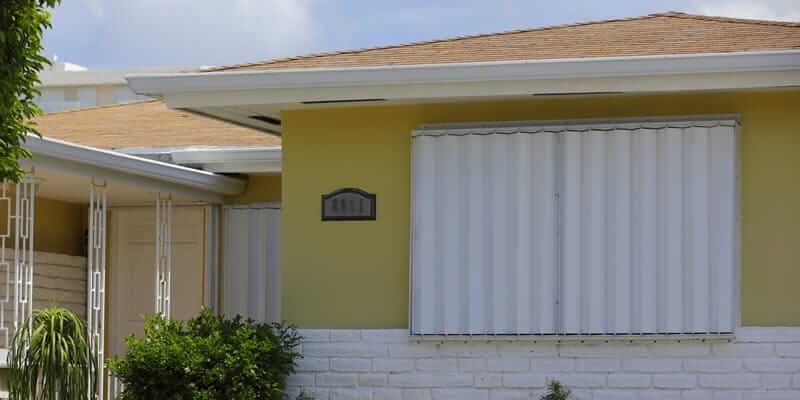 hurricane storm shutters on exterior of house