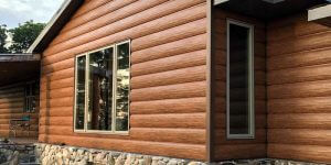 home with log cabin siding installed at cost