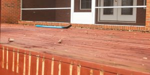 old wooden deck with wood damage and rot
