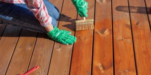 painting or staining a wooden deck