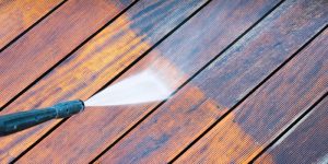 pressure washing a stained wood deck