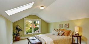 skylight window installed in a bedroom ceiling