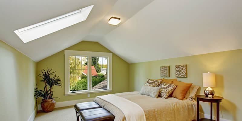 skylight window installed in a bedroom ceiling