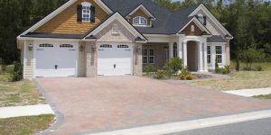 new home with a new brick paver driveway and 2 car garage