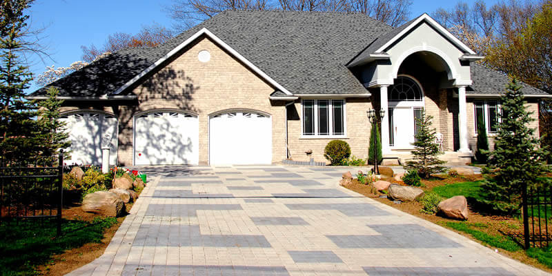 nice home with a brick paver driveway