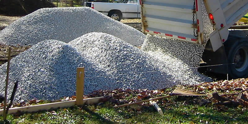 truck dumping a load of gravel