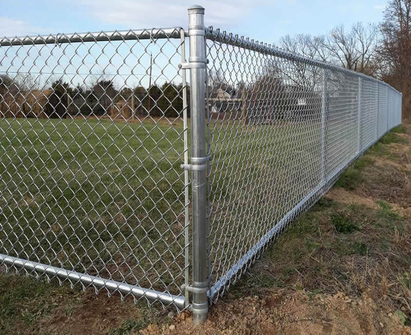 corner of a newly installed chain link fence